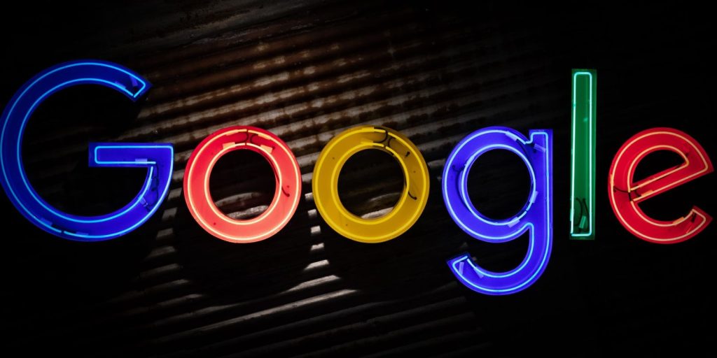 A Google logo made of neon lights with dark background